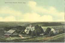 SA0325 - A view of the Enfield, CT community associated with the North Family. Buildings and fields are shown. Identified on the front., Winterthur Shaker Photograph and Post Card Collection 1851 to 1921c